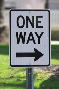 Road sign illustrating one way fees